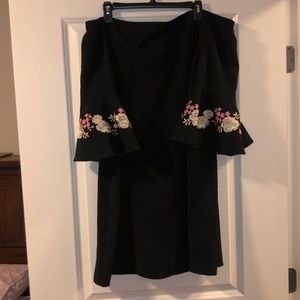 Black off the shoulder dress with floral appliqué